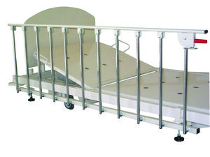bed rail attached to an adjustable bed