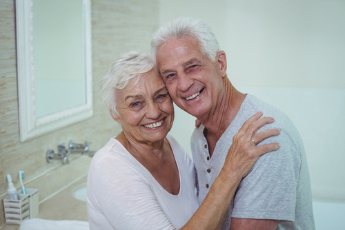 happy elderly couple inside a bathroom