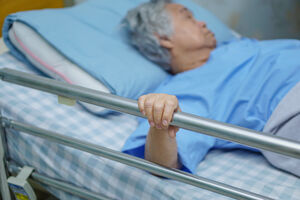 safety rails attached to an elderly woman+39s bed