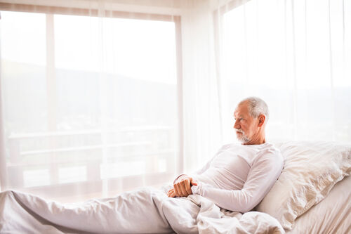 senior on an adjustable bed