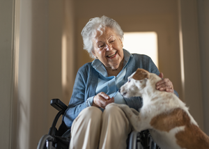 Senior woman enjoying time with her little dog